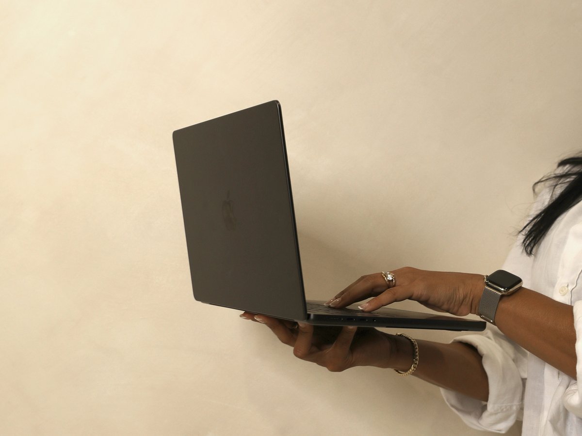 Amanda holding a laptop